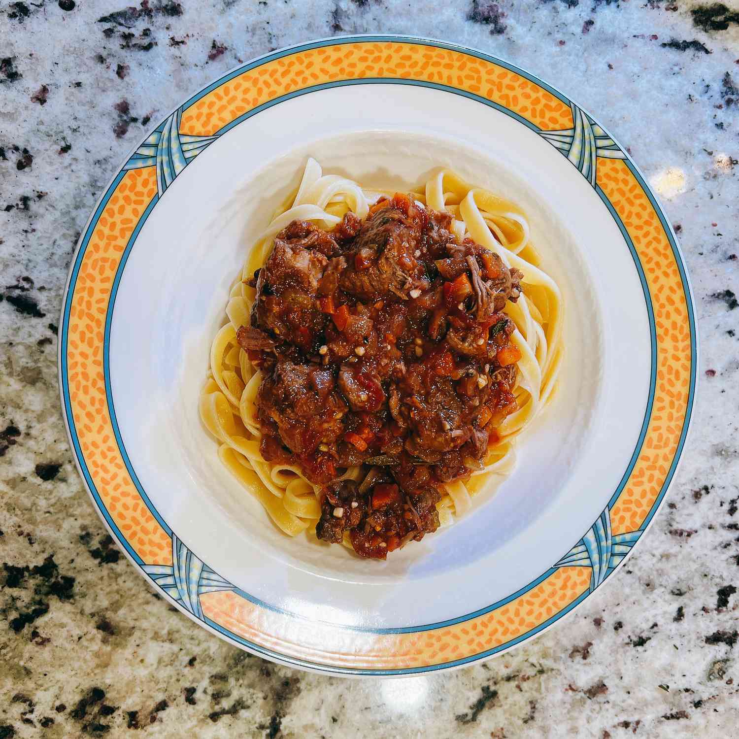 Slow-Braised Lamb Ragu with Tomatoes and Herbs