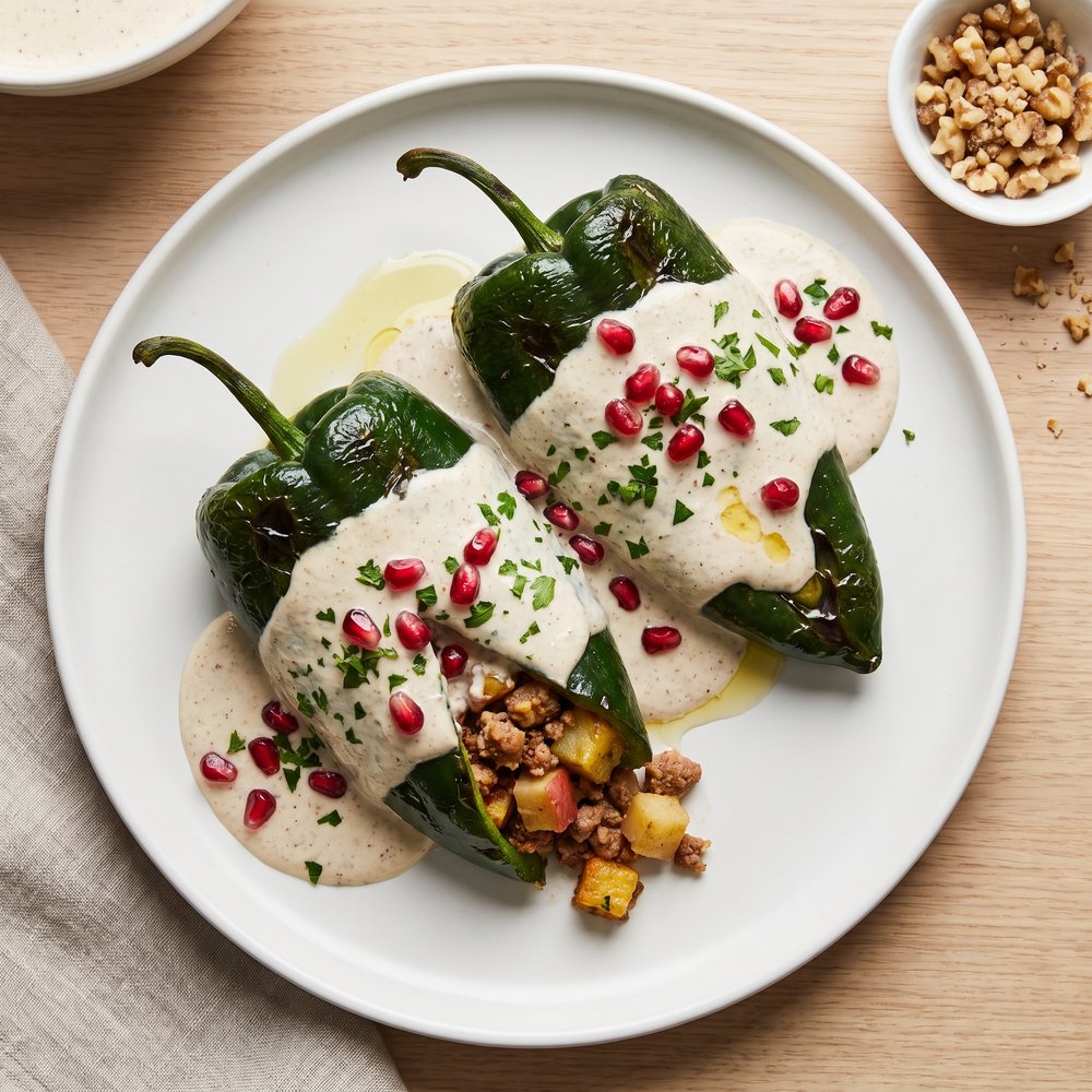 Chiles en Nogada (Poblano Peppers Stuffed with Pork and Walnut Nogada)