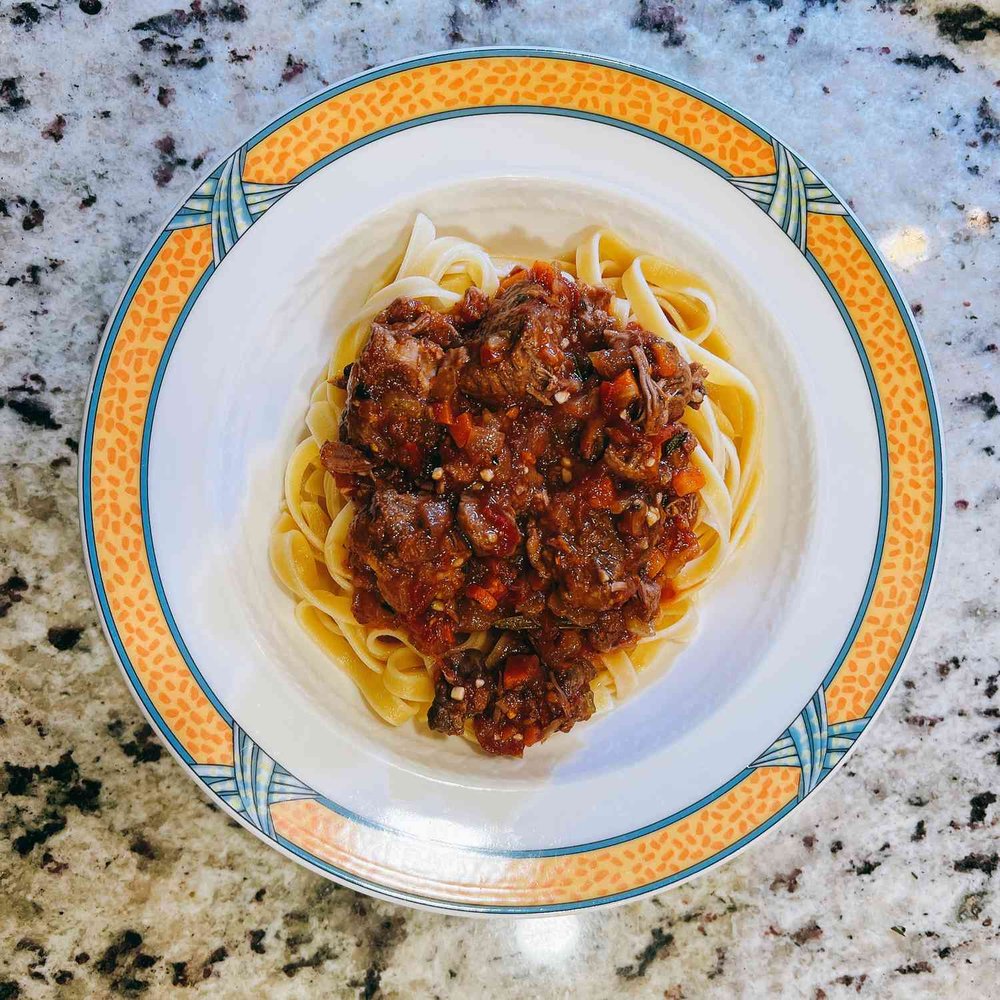 Slow-Braised Lamb Ragu with Tomatoes and Herbs